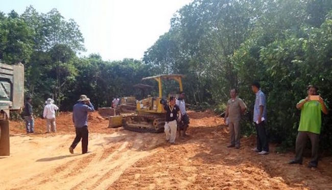 Authorities inspect a construction site for Bin Hai SEZ in Preah Sihanouk province in February after discovering hectares of mangrove forest had been filled in with soil.